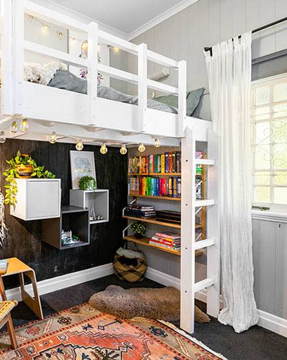 Kids bedroom with loft bed and study area