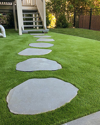 Large stepping stones on synthetic turf